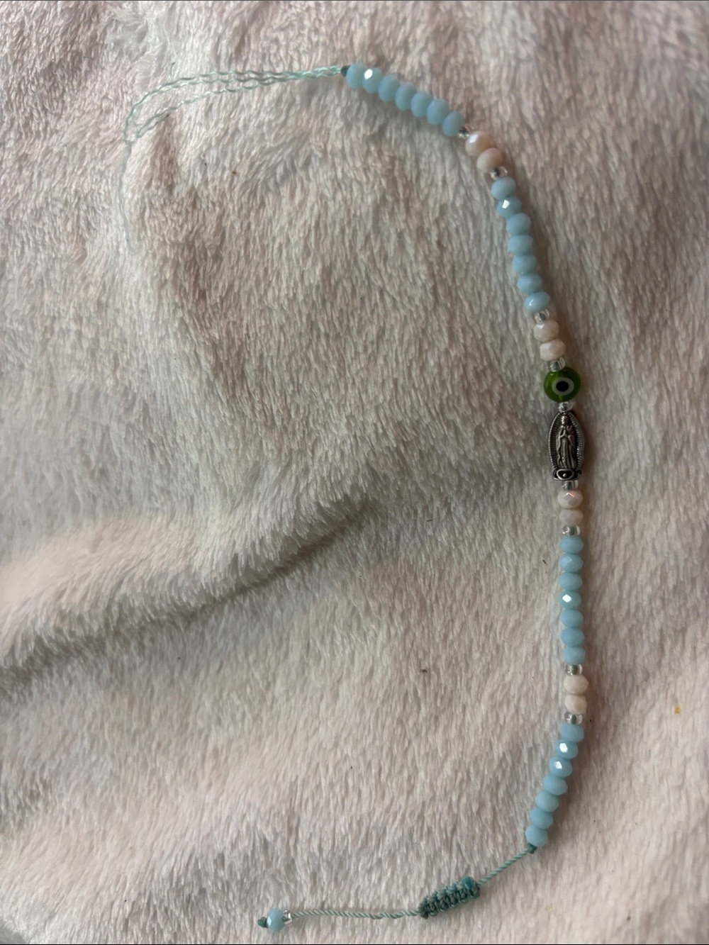 Light Blue Beaded Bracelet with Silver Charm and Green Accent